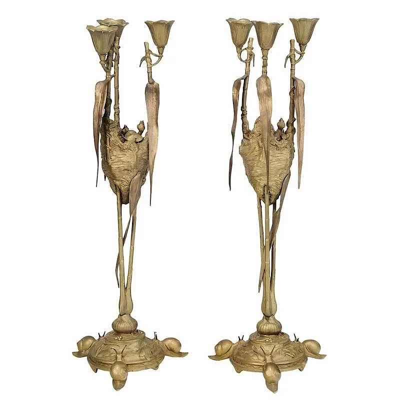 Untitled by August Nicholas Cain, pair of bronze three light candle holders raised on bamboo supports surrounding a birds nest with chicks, sold Jul 2017
