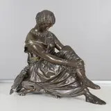 James Pradier, Sappho, a patinated bronze of a female seated on a stool