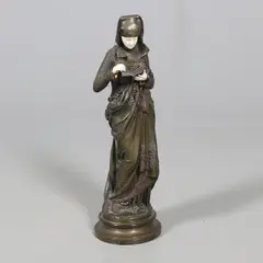 Albert Carrier-Belleuse, - Bronze & Ivory Figure 'Liseuse', A large bronze figure titled 'Liseuse'
