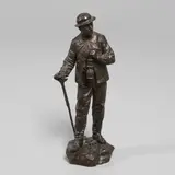 Eutrope Bouret, 'Sortie De La Mine', a patinated bronze study of a miner carrying a lamp