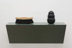 Untitled (brush, dog chew) 1A by Haim Steinbach, 2008, plastic laminated wood shelf, horsehair wood brush and rubber dog chew, sold Dec 2020