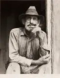 Marion Post Wolcott, A Spanish muskrat trapper in the doorway of his marsh home, Delacroix Island, St. Bernard Parish, Louisiana