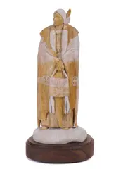 Oreland C. Joe, A standing Native American, carved stone