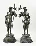 H 75 cm. by Twee bronzen poortwachters met hellebaarden, sold Apr 2026