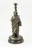 H 36,5 cm. by Antieke compositie metalen kaarskandelaar met Beethoven, sold Apr 2026