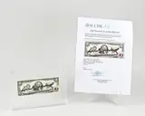 Two dollar biljet by Gesigneerd 2 Dollar biljet + postzegel door Andy Warhol, 1976, sold Apr 2023