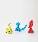 Jeff Koons, Three works: (i) Balloon Swan (Yellow) ; (ii) Balloon Rabbit (Red) ; (iii) Balloon Monkey (Blue), 2017, Three porcelain multiples painted in chrome, all contained in the original Styrofoam-lined presentation boxes with silver printed signature