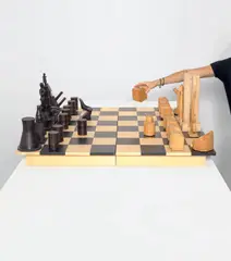 History Chess by Constantin & Laurene Boym, 2009, The complete folding wooden chess board and set including 32 unique hand-carved figures, sold Oct 2020