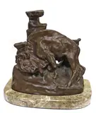 Buffalo rubbing rock accompanied by a framed card by Charles Marion Russell, bronze with brown patina on a marble base, sold Apr 2013
