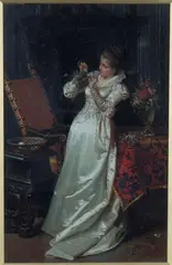 A Lady wearing a Silk Gown within an Interior Setting, arranging a Bouquet of Flowers by Pio Ricci, oil on canvas, sold Dec 2021