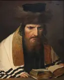 Portrait of a Rabbi reading a Book at a Table by Alois Heinrich Priechenfried, oil on canvas, sold Mar 2013