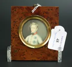 A. Lenoir, Tondo Miniature Half Length Portrait of a Prince wearing a Cream Jacket with Military Decorations, watercolour on ivory