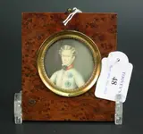 A. Lenoir, Tondo Miniature Half Length Portrait of a Prince wearing a Cream Jacket with Military Decorations, watercolour on ivory