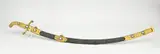L 93 cm. by Decoratief krom-zwaard, Antiek decoratief krom-zwaard, met brons verguld heft, parelmoer en turkoois, sold Apr 2025