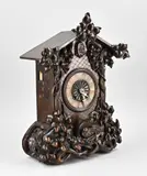 1870 by Antieke Schwarzwalder koekoeksklok van notenhout, Antieke Schwarzwalder koekoeksklok van notenhout, sold Apr 2025