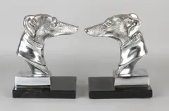 2x Boekensteun, Windhonden, Twee boekensteunen met chromen windhonden op zwart marmeren basement