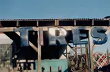 William Eggleston, Untitled (tire sign)