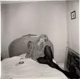 Diane Arbus, Girl in a coat lying on her bed, N.Y.C., 1968, Gelatin silver print, printed later by Neil Selkirk