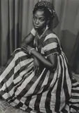Seydou Keïta, Untitled (young woman wearing a black and white striped dress)