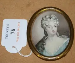 E. Desmond, Oval Miniature Head and Shoulders Portrait of a Lady, her Hair dressed in Pearls, watercolour on ivory