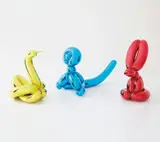 Three works: (i) Balloon Swan (Yellow); (ii) Balloon Rabbit (Red); (iii) Balloon Monkey (Blue) by Jeff Koons, 2017, mirror-polished stainless steel with transparent color coating, sold Feb 2019