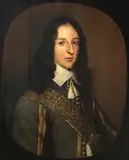 Gerrit van Honthorst, A portrait of a gentleman, half-length, oil on cradled panel, in a painted oval