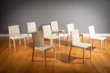 Cattelan Italia, A Set Of Eight Cream Leather Dining Chairs,