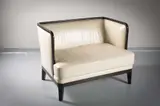 Andree Putman, A Leather Upholstered Two Seat Chair Back Sofa