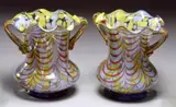 Pair Of Bohemian Spatter Glass Vases, Untitled, A striking pair of Bohemian spatter glass vases with ruffled rim and twin handles, patterned in yellow, white and red colours. Circa 1890 - 1910.