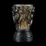 René Lalique (French, 1860–1945), A Topaz 'Bacchantes' Vase With Bronze Stand by René Lalique, glass, press-moulded, frosted and polished, wheel-cut R, sold Nov 2025
