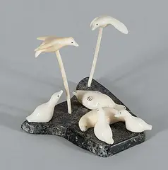 Emily Pangnerk Illuitok, Untitled - Birds Flying Over Seals, bone and stone carving