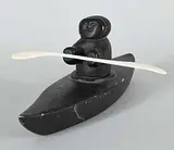 . Levi, Untitled - Lone Kayaker, black stone and bone carving