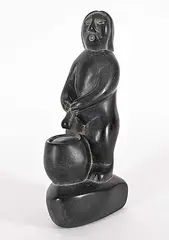 Johnny Iquliq, Untitled - Man Peeing Into Pot, black stone carving