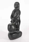 Johnny Iquliq, Untitled - Man Peeing Into Pot, black stone carving