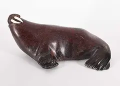 Simon Peinatupl, Untitled - Basking Walrus, red stone and bone sculpture