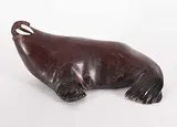 Simon Peinatupl, Untitled - Basking Walrus, red stone and bone sculpture