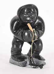 Untitled - Fisherman by Willie Weetaluktuk, 1985, black stone and mixed media sculpture, sold Mar 2025