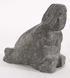 Angela Iqulik, Seal-Woman, grey stone carving