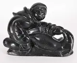 Untitled - Seal Wrangler by Abraham Niaquq Irquq, 1975, black stone carving, sold Sep 2024