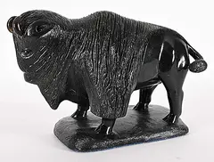 Ronald McKay, Bison, 2006, black stone and bone sculpture