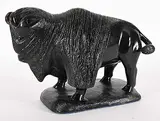 Ronald McKay, Bison, 2006, black stone and bone sculpture