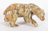 Bill Nasogaluak, Stalking Polar Bear, 2002, brown stone carving