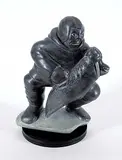 Nalookie Quananack, Man and Seal, 1979, dark grey stone carving
