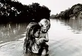 Larry Towell, Isaac's First Swim, Lambton County, Ontario, Canada, 1986, black and white photograph on paper