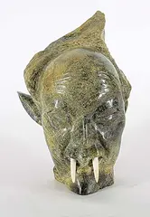 Shaman by Kellypalik Qimirpik, 1979, green stone and bone carving, sold Sep 2021