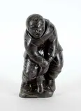 Hunter Pulling Seal from Ice by Juanisi Irqumia Kuanana, black stone carving, sold Mar 2021