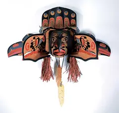 Junior Henderson, Raven Transforming to Hunter of the Woods, 2016, painted wood carving with shells and bark
