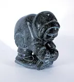 Charlie Inukpuk, Untitled - Crouching Hunter, dark grey stone carving