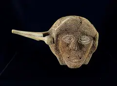 Pauloosie Kuniliusee, Shaman Face with Two Walrus and Sedna, bone sculpture