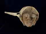 Pauloosie Kuniliusee, Shaman Face with Two Walrus and Sedna, bone sculpture